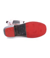 A pair of Clarisse shoes with red soles on a white background by Bed Stu.