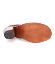 A Clavel brown leather shoe with a black sole by Bed Stu.