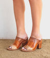 A woman in a pair of Bed Stu Clavel brown mule sandals.