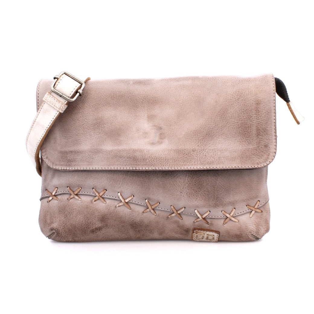 A leather crossbody bag with straps and studs by Bed Stu.