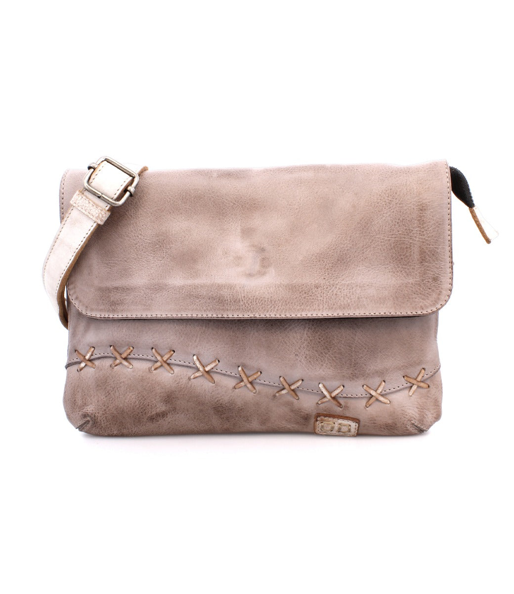 A leather crossbody bag with straps and studs by Bed Stu.