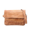A tan Cleo leather crossbody bag from Bed Stu with an adjustable strap.