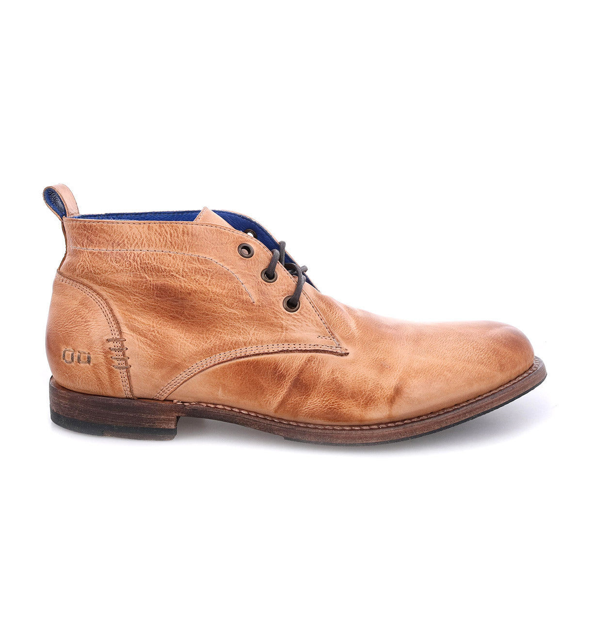 The Clyde by Bed|Stü is a light brown leather chukka ankle boot featuring hand-stitched detailing, black laces, blue interior lining, and a low wooden sole, shown from the side.