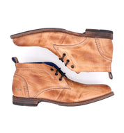 A pair of Clyde leather chukka boots by Bed Stu on a white background.