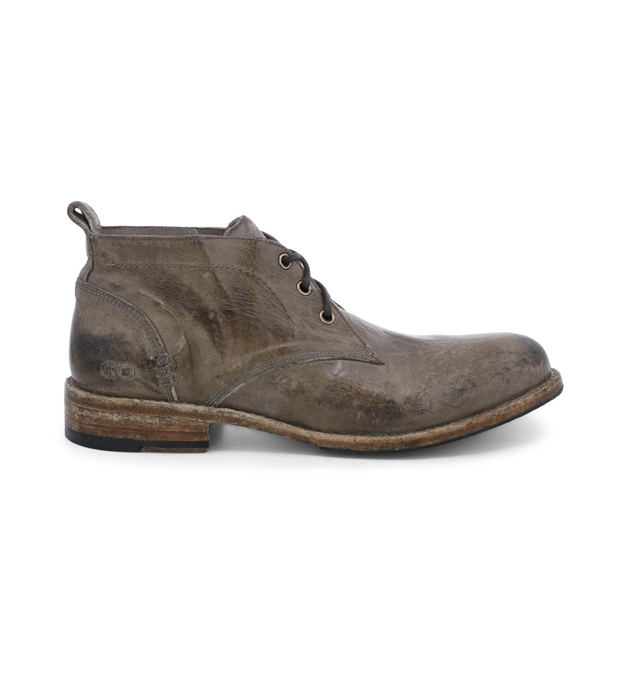 The Bed|Stü Clyde is a brown leather chukka lace-up ankle boot with a low heel and round toe, featuring visible scuffs and hand-stitched detailing for a rugged appearance. Shown from the side against a white background.