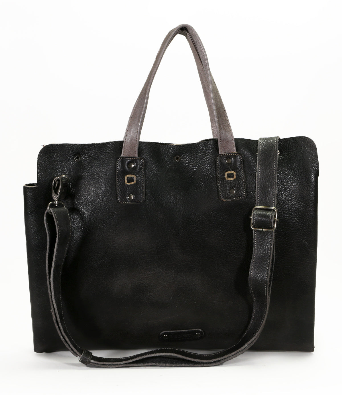 A multifunctional Bed Stu Commuter tote bag in black leather, with a shoulder strap for laptops up to 15 inches.