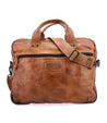 A Bed Stu Conclusion laptop bag with a shoulder strap, perfect for carrying your work essentials.