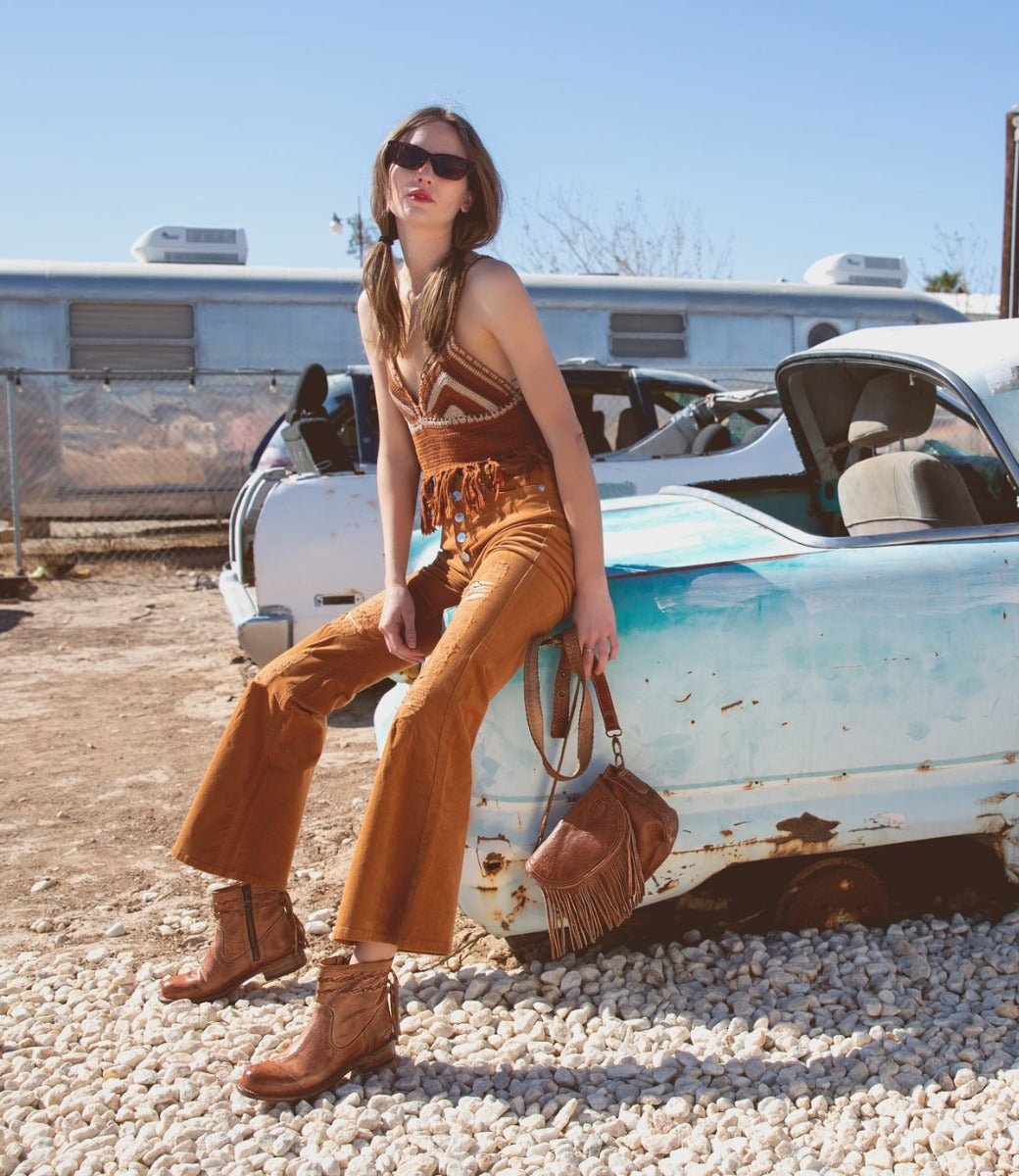 A woman wearing Craven boots by Bed Stu.