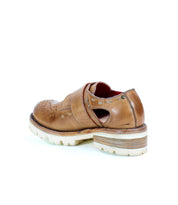 A pair of brown Dagny perforated shoes with a leather sole by Bed Stu.