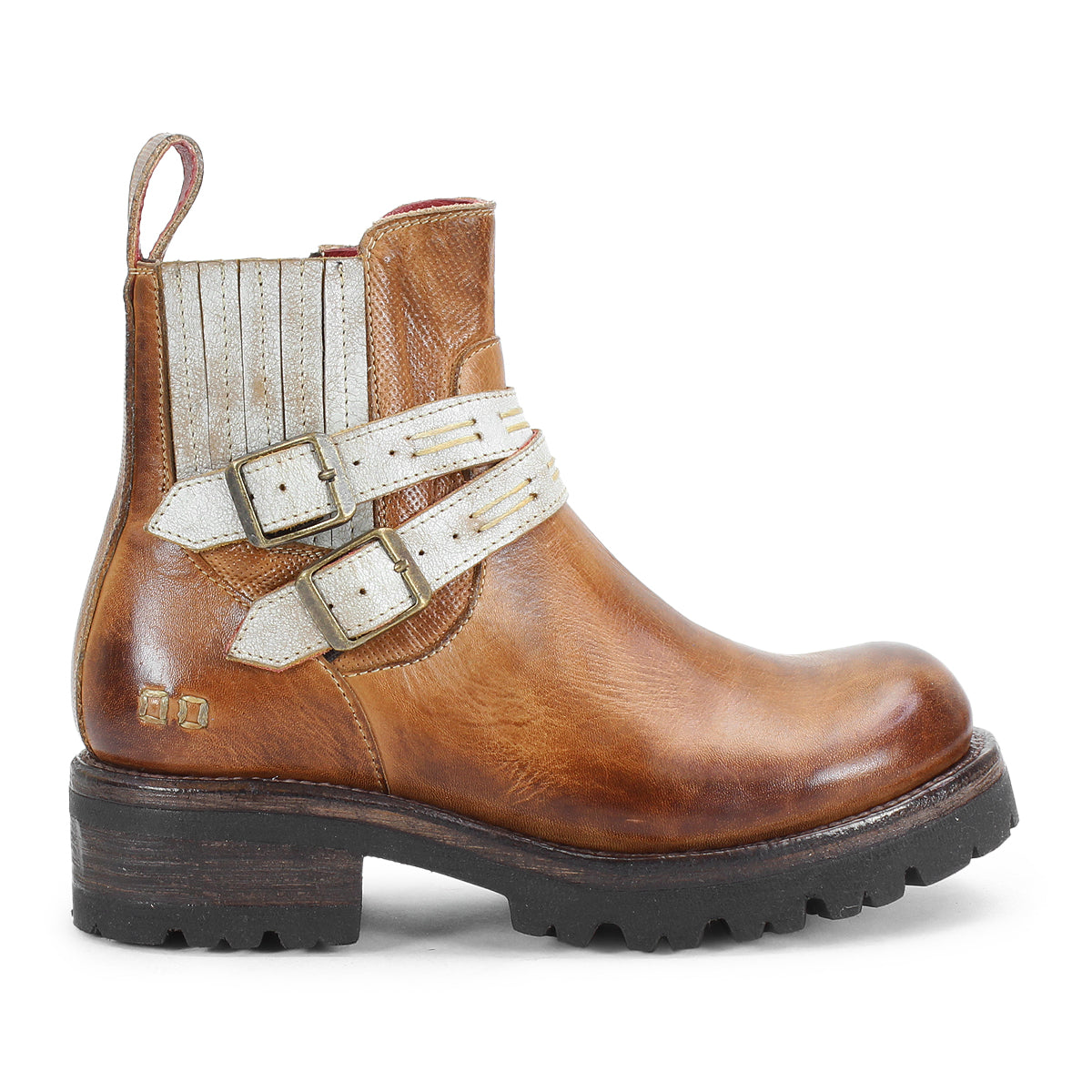 The Daring ankle boots by Bed Stu feature brown leather, rugged soles, two white adjustable buckle straps with metallic accents, a stacked heel, and a rear pull tab.