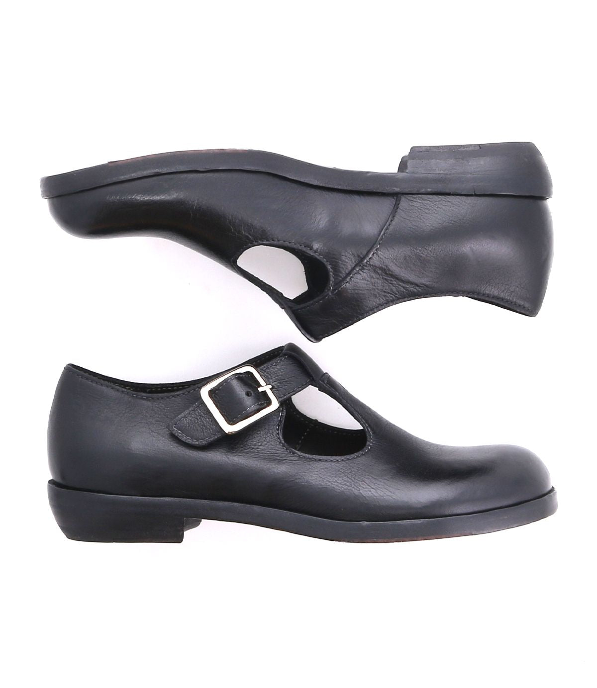 A black Italian shoe with a t-strap and a buckle for women
