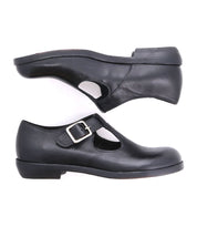 A black Italian shoe with a t-strap and a buckle for women