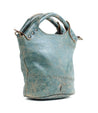 A blue Delilah handbag with a Bed Stu leather handle.