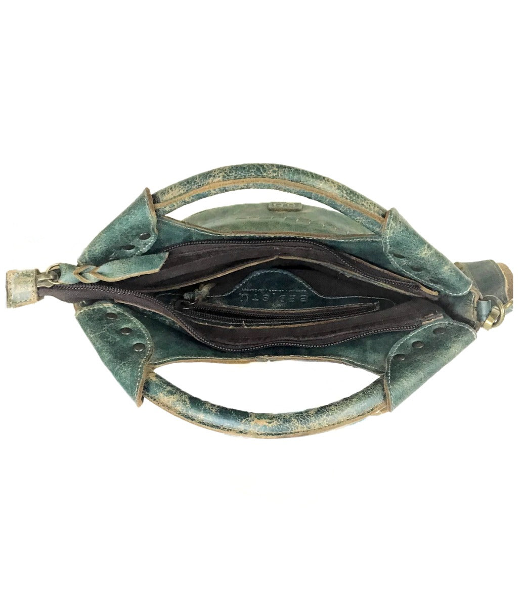 The inside of a Delilah by Bed Stu green leather purse.