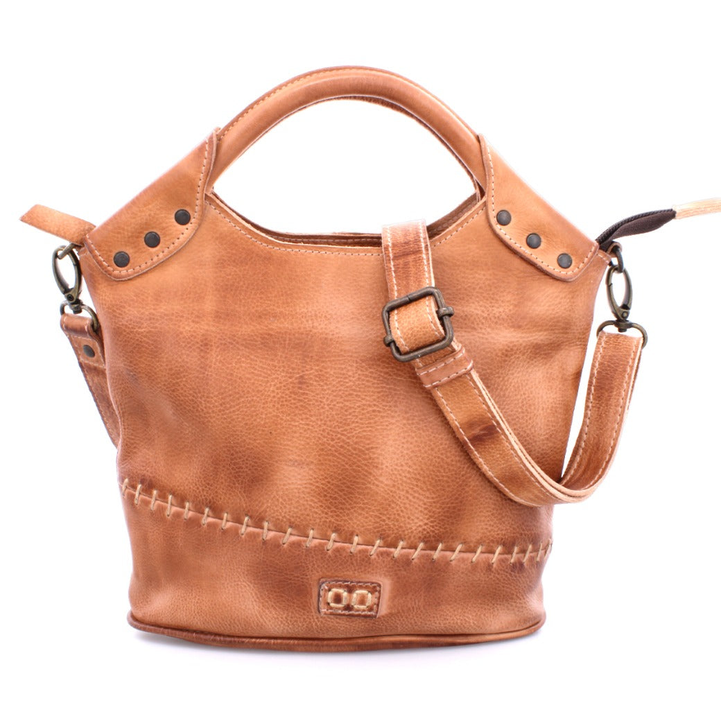A Delilah bag by Bed Stu, made of tan leather with a strap and handle.