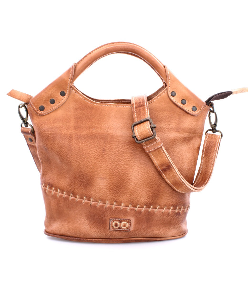A Delilah bag by Bed Stu, made of tan leather with a strap and handle.
