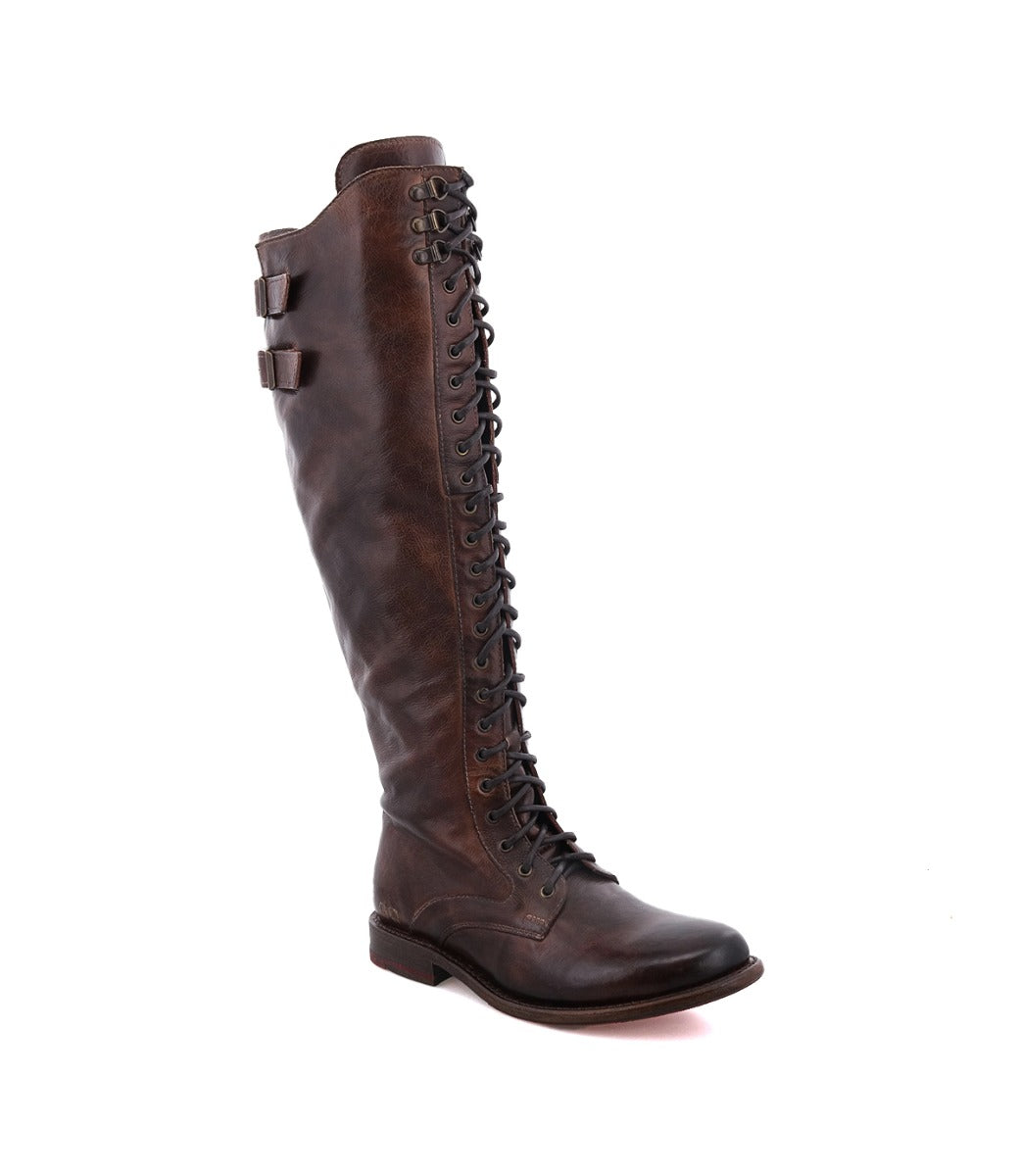 A women's brown boot with laces and buckles, the Della by Bed Stu.