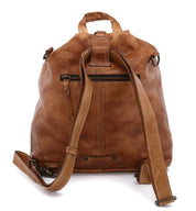 A brown leather Delta backpack with straps and zippers made by Bed Stu.