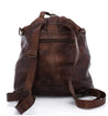 A Bed Stu Delta brown leather backpack on a white background.