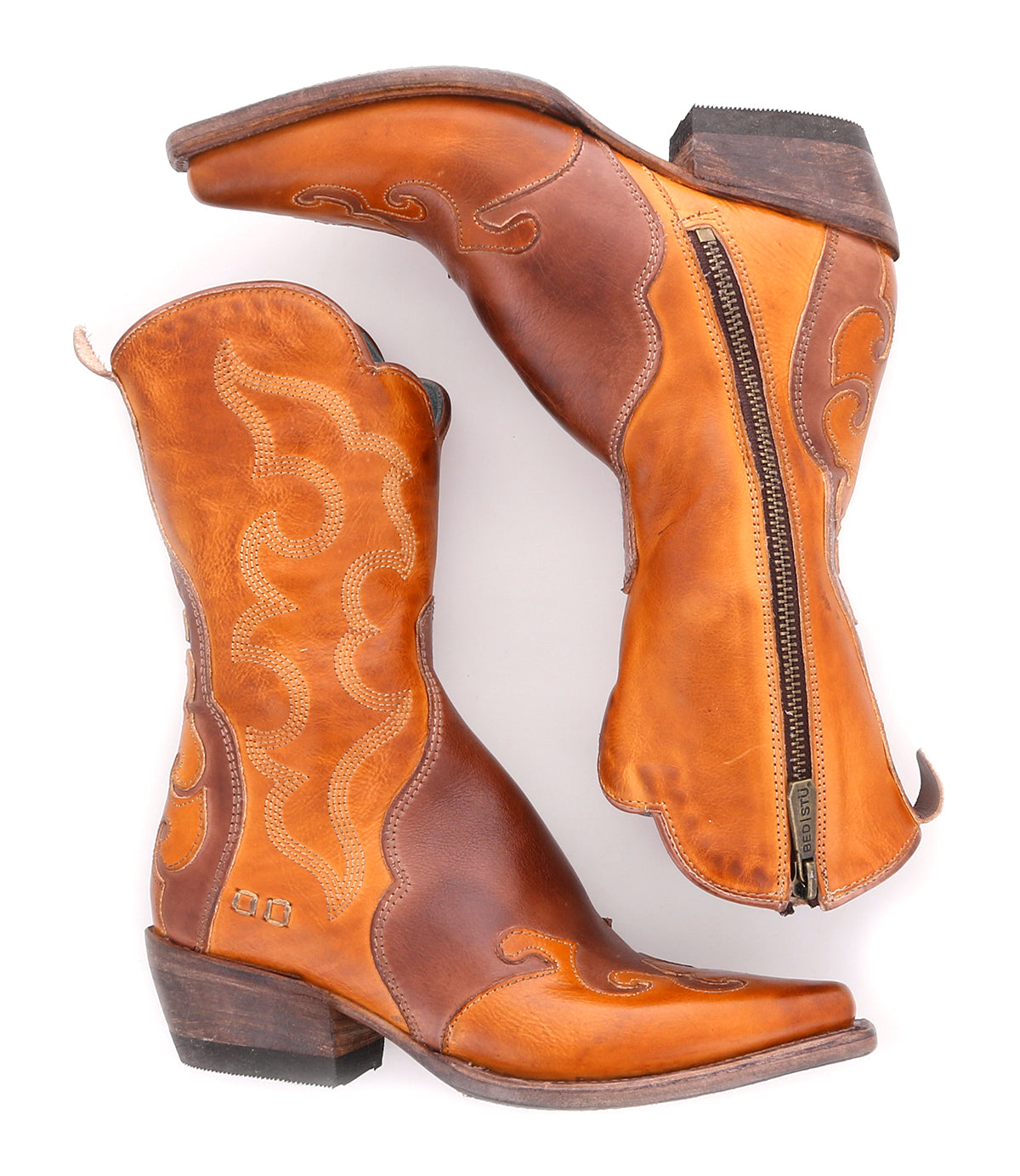 A pair of Deuce leather cowboy boots from Bed Stu with rustic charm and a zipper on the side.