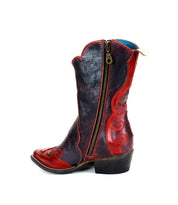 The Bed Stu Deuce women's mid-calf cowboy boot, crafted from vegetable-tanned leather in dark blue and red, features a decorative design and a side zipper closure, embodying the classic western style.