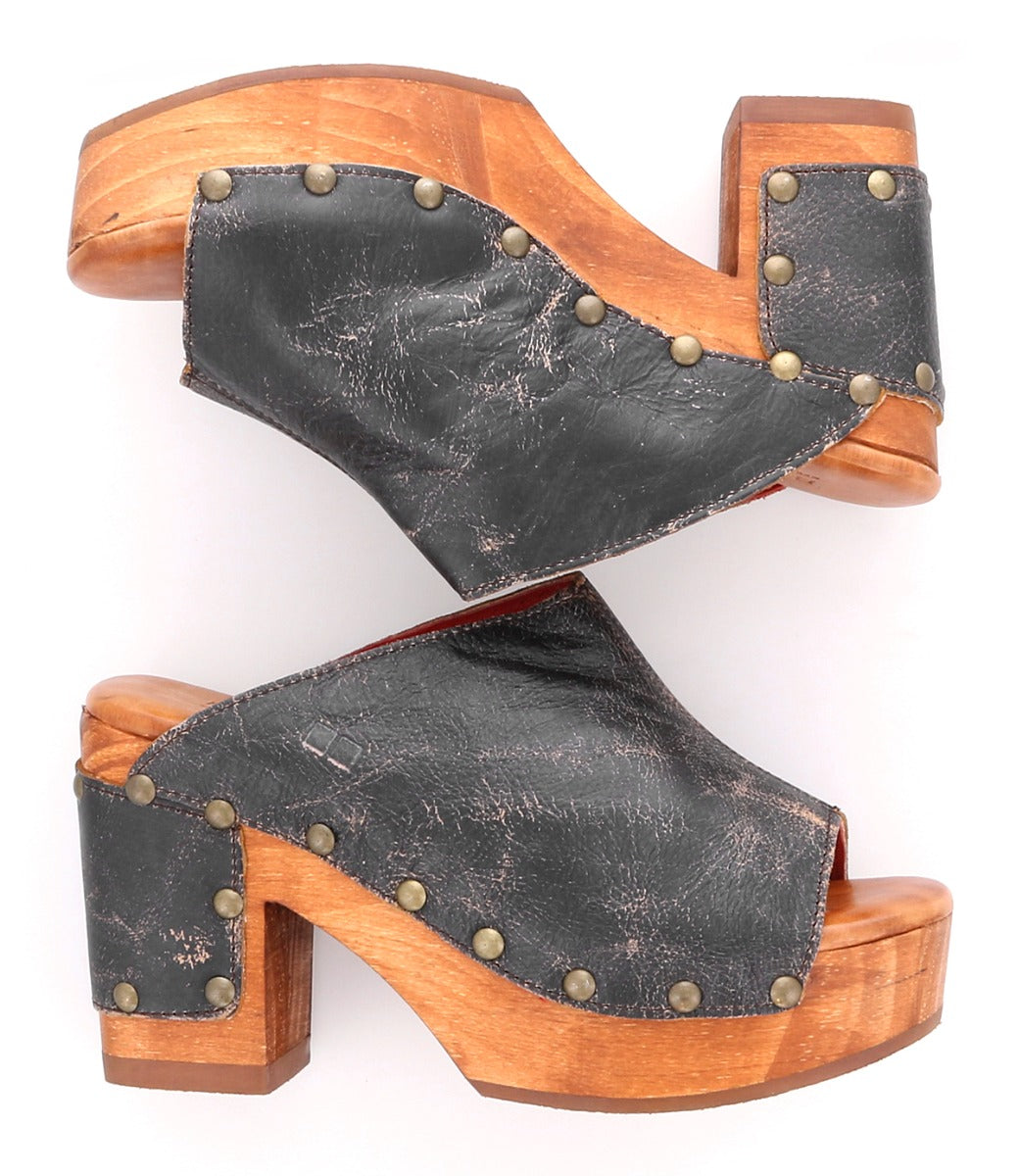 A pair of black leather Deva clogs with wooden heels by Bed Stu.