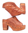 A pair of brown leather Deva clogs from Bed Stu.