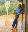 A woman wearing leather Deva clog with wooden heels by Bed Stu.