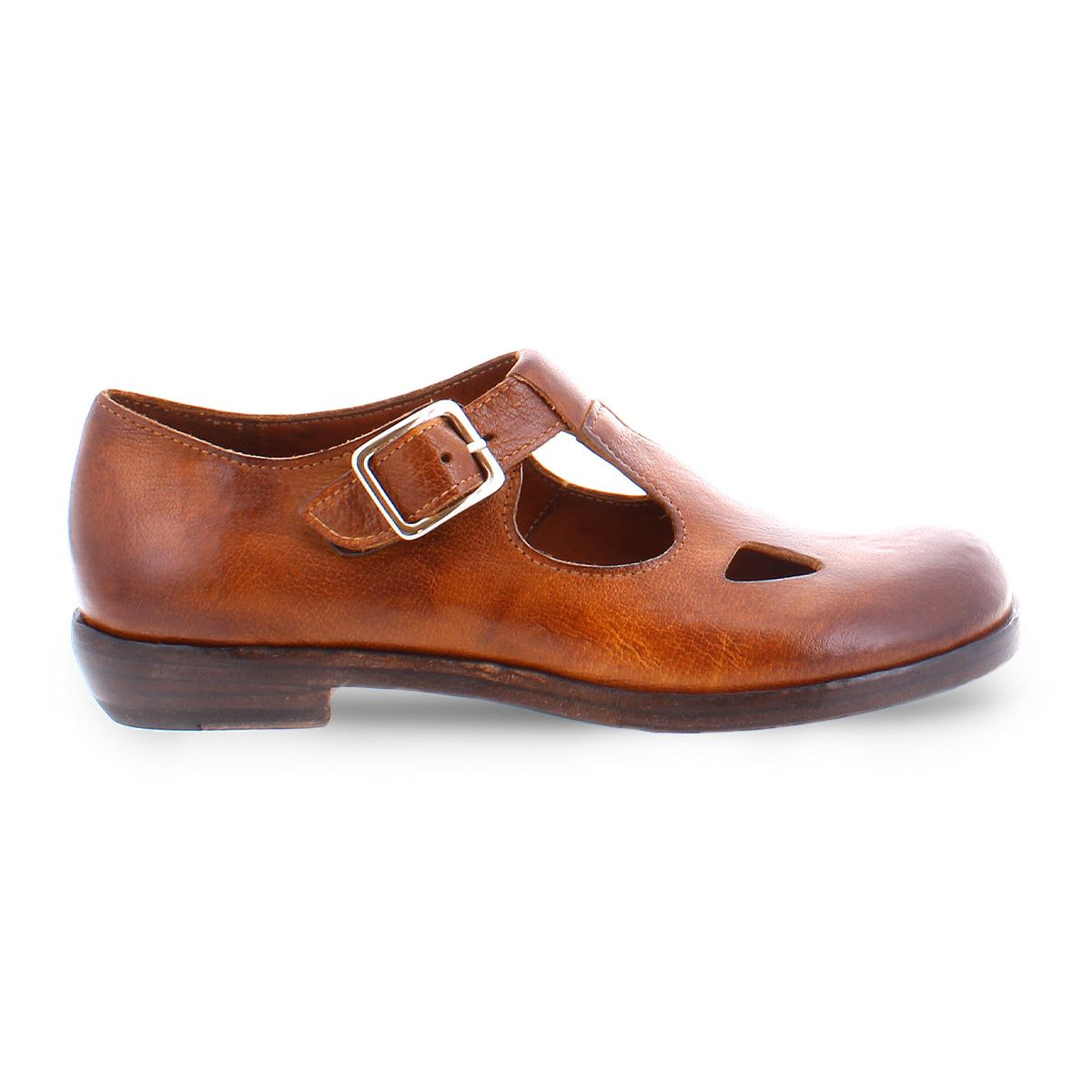 A product shot of a  brown leather shoe for women made with Italian leather and has cutouts in a t-strap  type of shoe. 