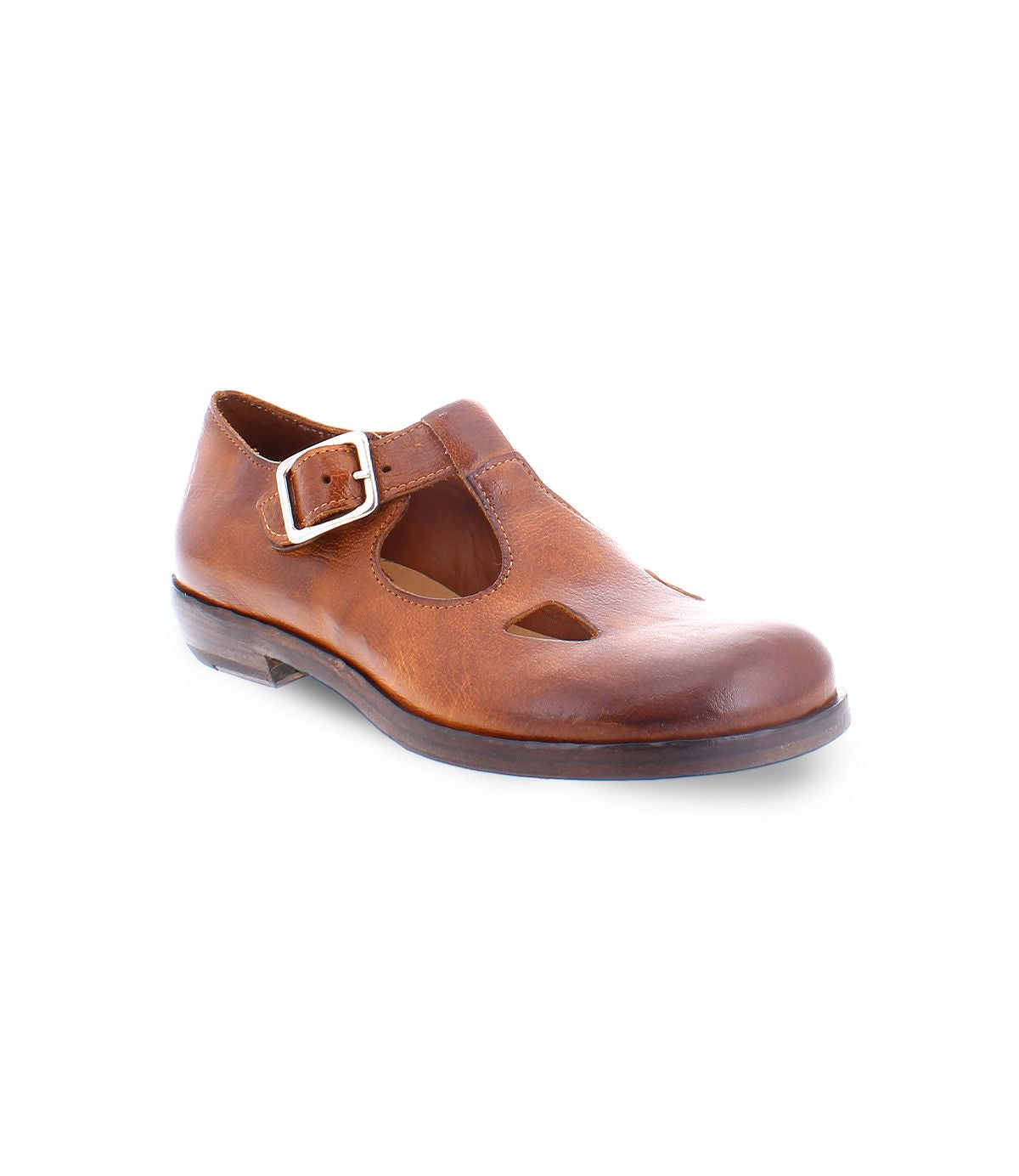 A product shot of a  brown leather shoe for women made with Italian leather and has cutouts in a t-strap  type of shoe. 