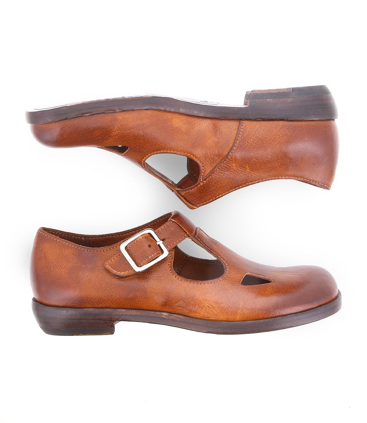 A product shot of a  brown leather shoe for women made with Italian leather and has cutouts in a t-strap  type of shoe. 