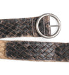 A Dreamweaver leather belt with a metal buckle by Bed Stu.