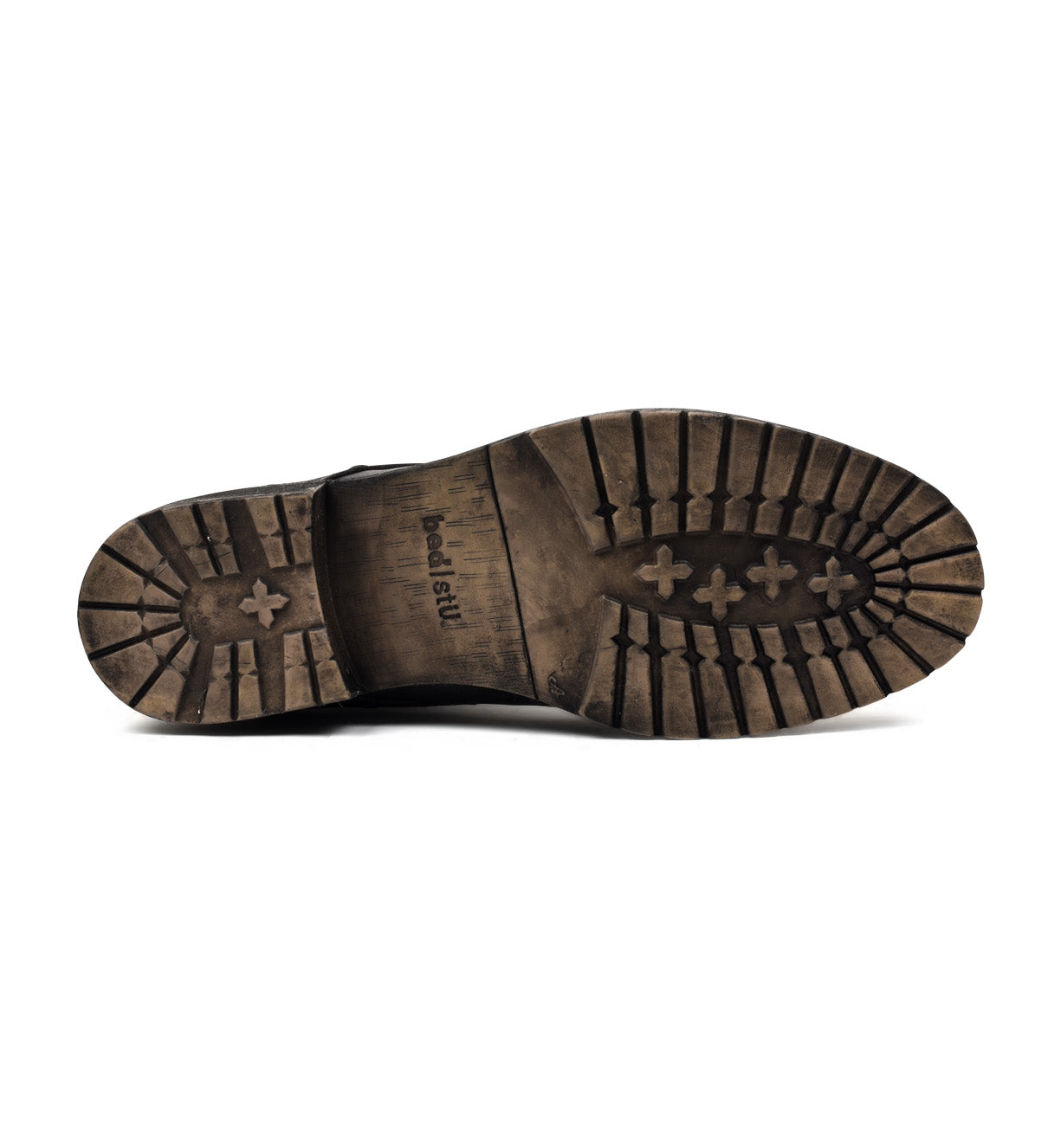 The sole of a Bed Stu black shoe on a white background.