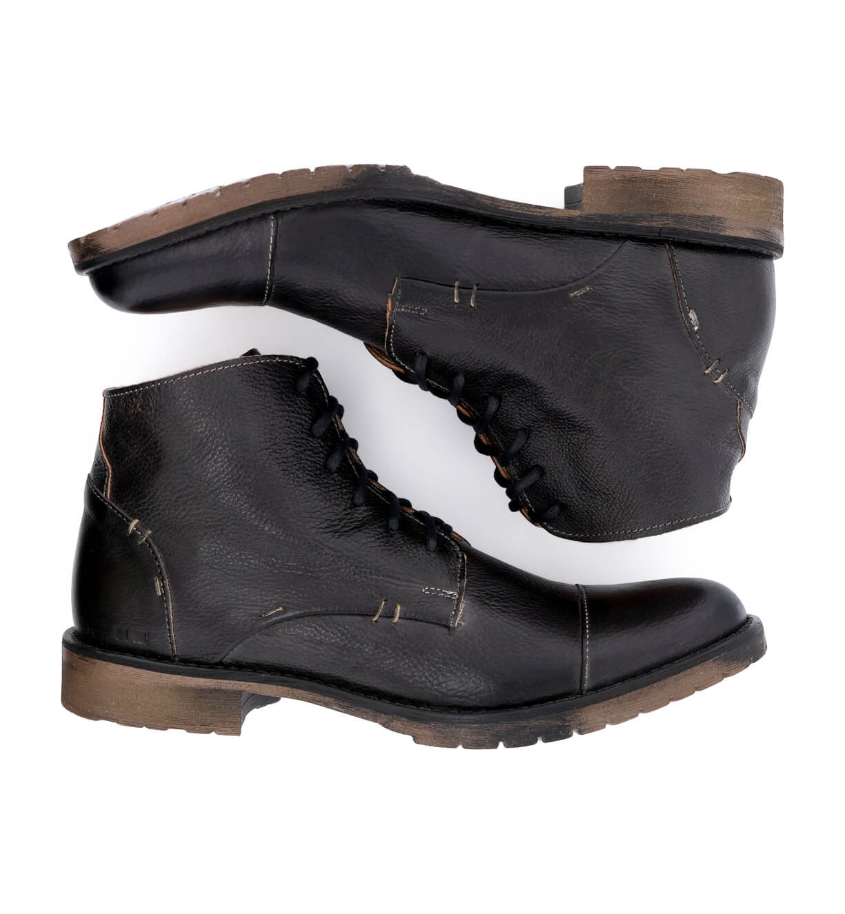 A pair of Bed Stu black leather boots on a white background.