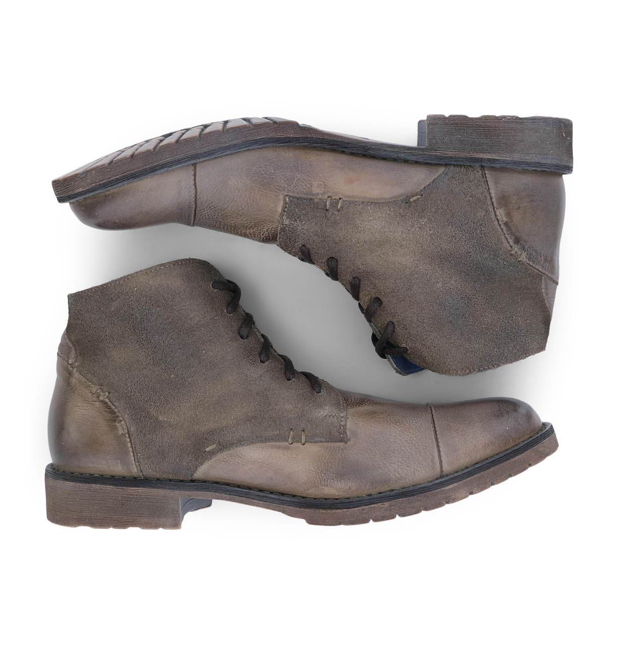 A pair of Bed Stu brown leather boots on a white background.