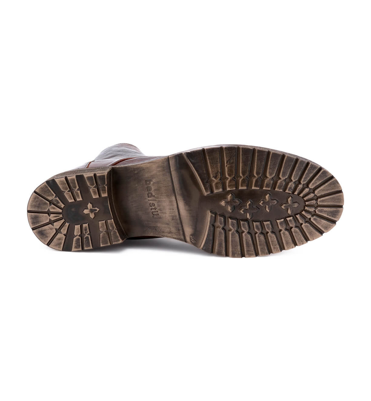 The sole of a Bed Stu brown leather shoe on a white background.