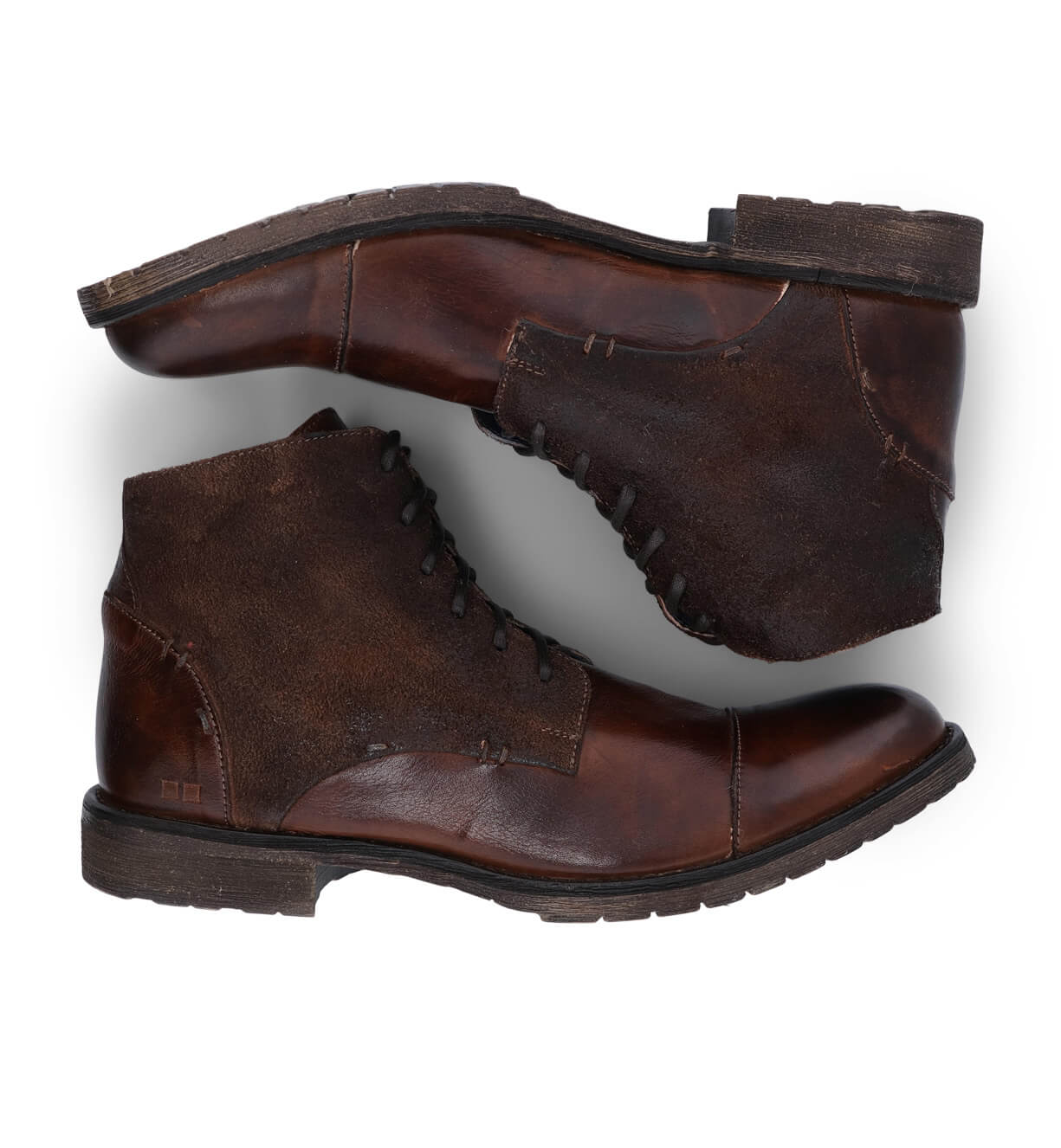 A pair of Bed Stu brown leather boots on a white background.