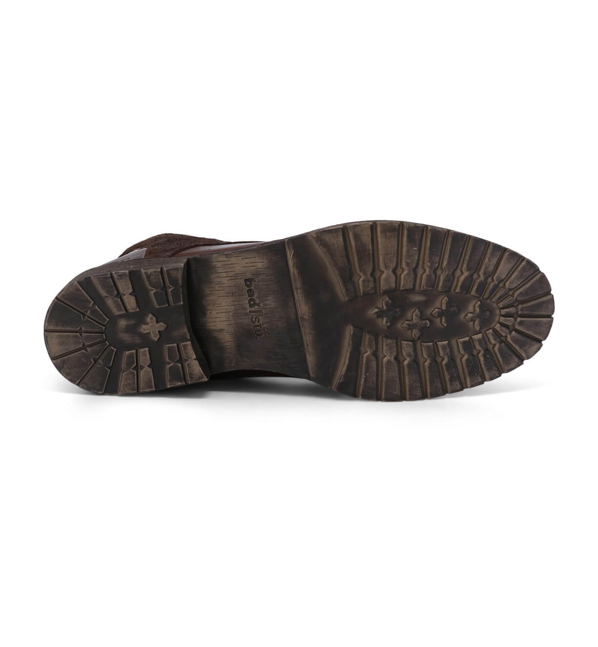The sole of a Bed Stu Dreck brown shoe on a white background.
