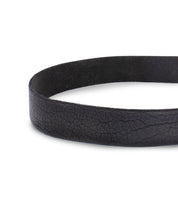 Close-up image of the Drifter black leather belt by Bed Stu, featuring a visible textured surface that showcases its clean and solid design—a perfect weekend accessory that adds dapper appeal.