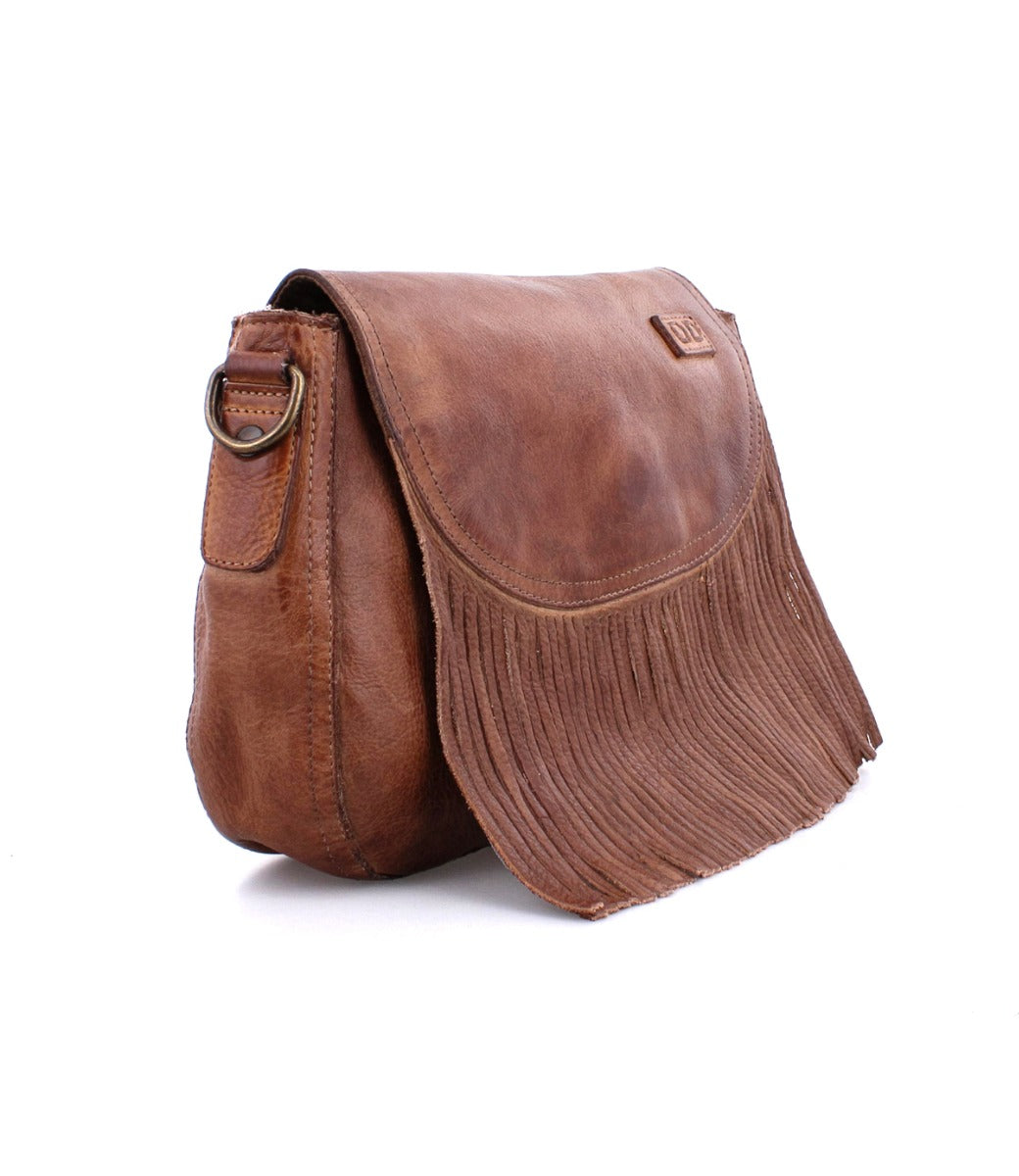 A brown leather Bed Stu Eastend crossbody bag with fringes.