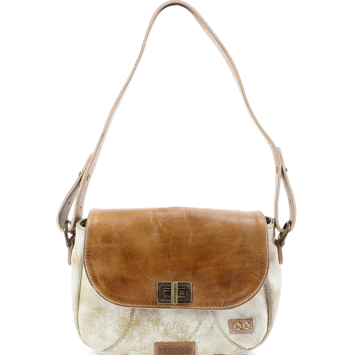 The Bed Stu Elect is a chic tan and cream shoulder bag with a flap closure. It features vintage charm through its metal hardware and a small emblem, while the adjustable shoulder strap adds comfort and versatility.