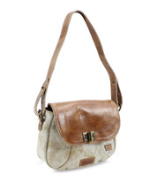 The Elect by Bed Stu is a chic beige and brown leather shoulder bag with a flap closure and adjustable strap, exuding vintage charm.