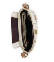 The Elect shoulder bag by Bed Stu exudes vintage charm with its open design, visible compartments, and classic clasp against a simple backdrop.