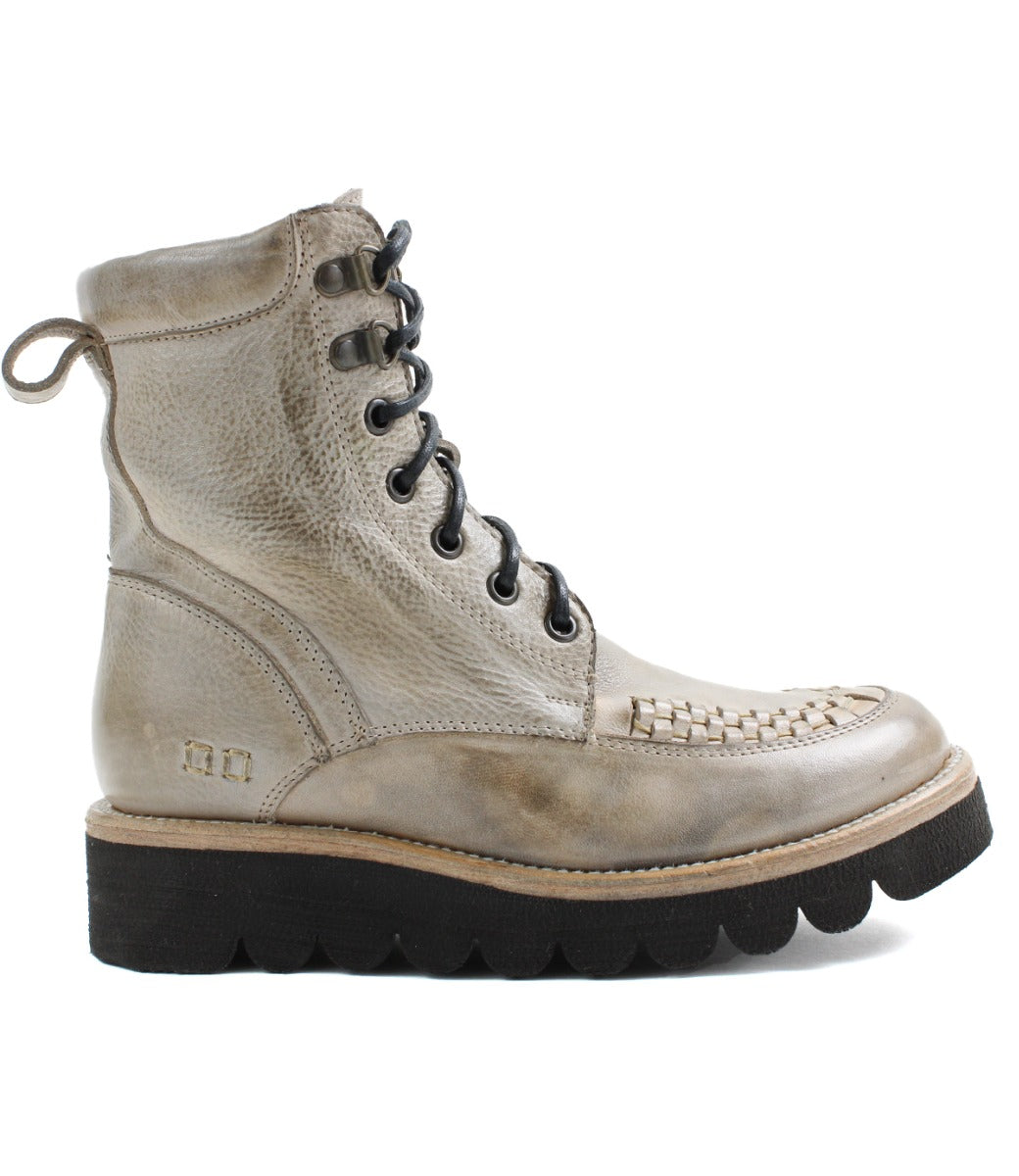 A women's ankle boot in beige with black soles called Elisha II by Bed Stu.