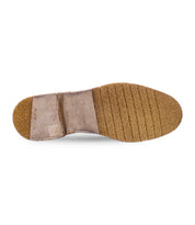 Bottom view of the Bed Stu Elude men's leather boot with a textured rubber sole and visible brand imprint. The handcrafted design, made in Italy, exhibits timeless elegance though the sole shows signs of wear.
