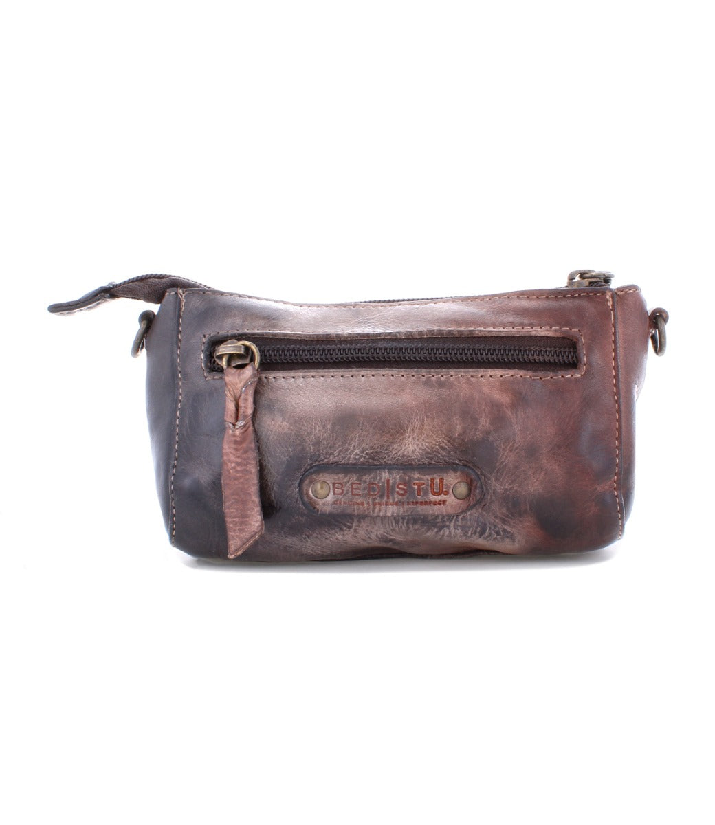 An Encase brown leather purse with a zipper by Bed Stu.