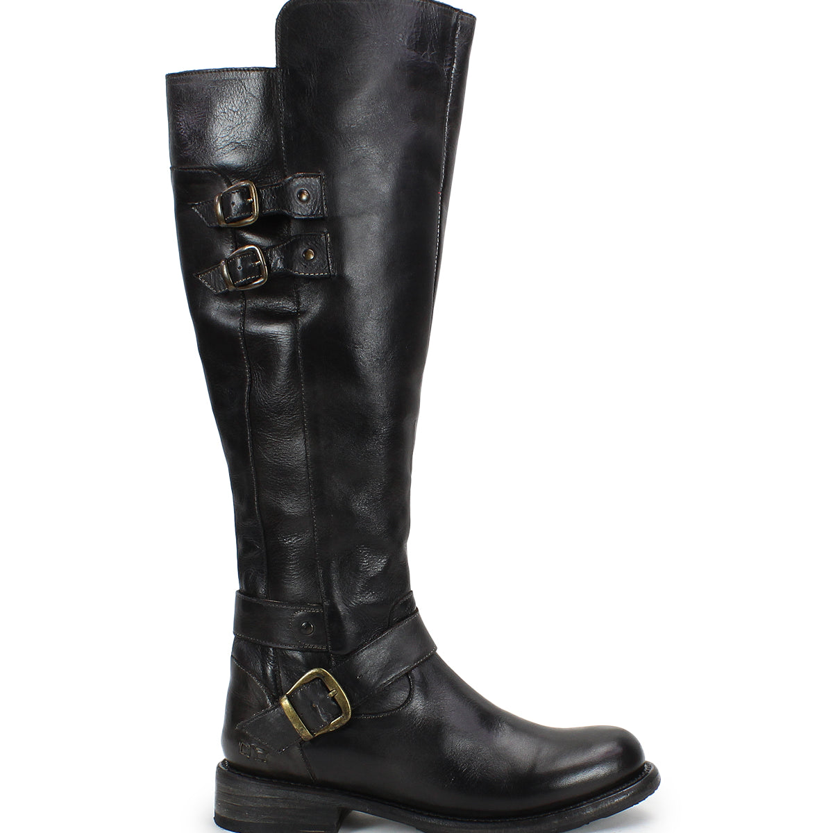 The Bed Stu Essence is a tall black knee-high riding boot with hand-finished leather, three brass buckles, a low stacked heel, and a slightly rounded toe, shown in side profile on a white background.