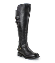 The Essence by Bed Stu is a tall, knee-high boot made from hand-finished leather, with a low heel, decorative ankle and calf buckles, and a rounded toe for classic equestrian style.