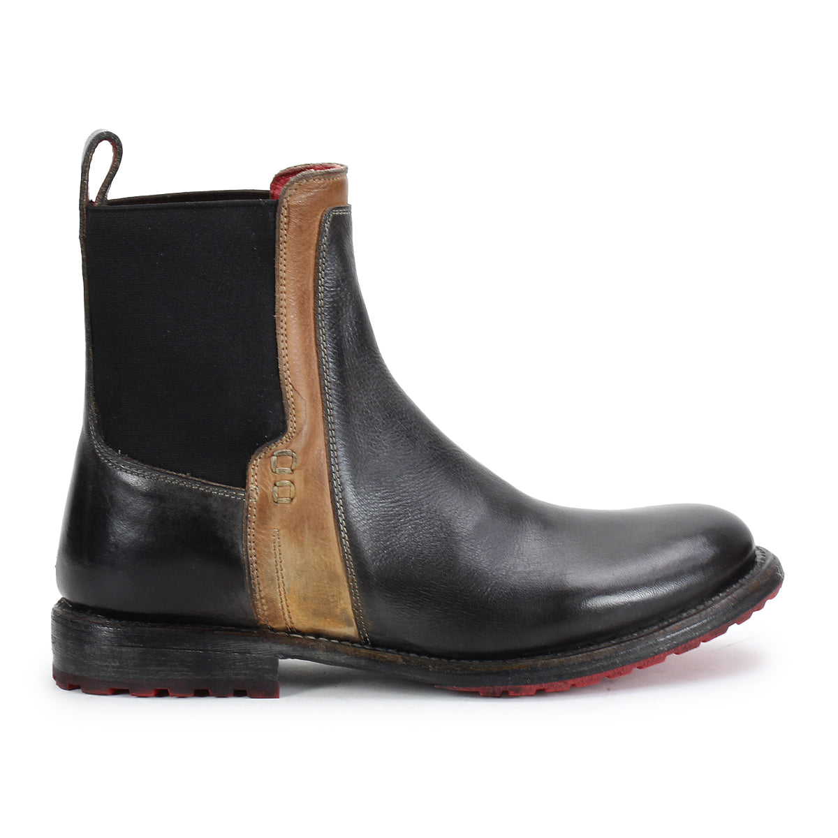 The Bed Stu Ethic is a black Chelsea boot in vegetable-tanned leather with a brown accent panel, black elastic side, and red-tread Vibram sole, shown in profile.