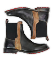 The Bed Stu Ethic boots feature vegetable-tanned leather, black sides, brown ankle accents, elastic panels, red outsoles, and rear pull tabs, displayed side by side.